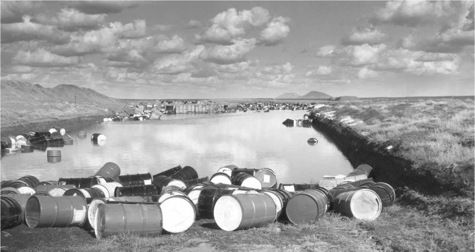 Plutonium waste barrels float in spring thaw at Idaho National Lab.